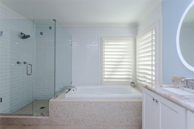 bathroom with crown molding, a shower stall, and a bath