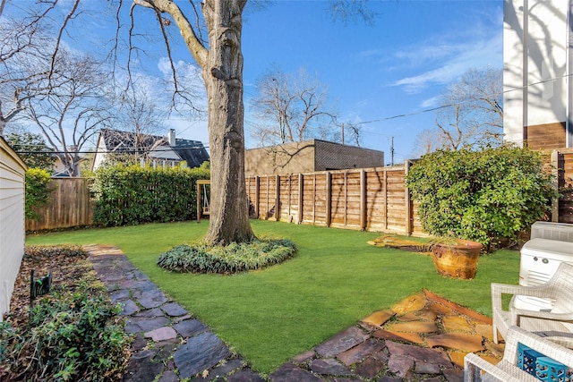 view of yard with a fenced backyard