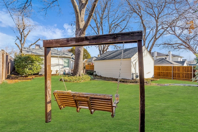 view of yard featuring a fenced backyard and an outbuilding