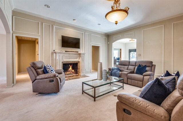 2701 Shadow Dr W, Arlington, TX 76006 - carpeted living area with arched walkways, ornamental molding, and a decorative wall