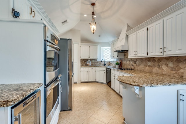 kitchen with wine cooler, white cabinetry, oven, and custom range hood