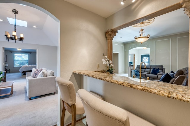 2701 Shadow Dr W, Arlington, TX 76006 - dining space with arched walkways and light colored carpet