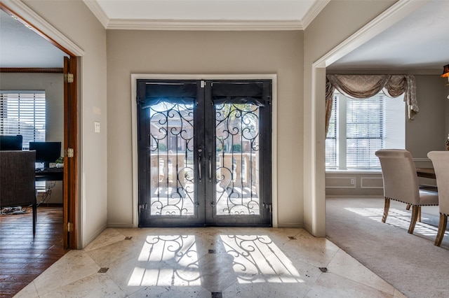 2701 Shadow Dr W, Arlington, TX 76006 - carpeted foyer entrance featuring french doors, baseboards, crown molding, and tile patterned floors