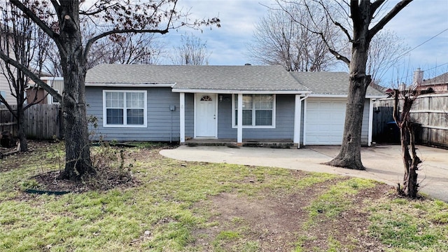 ranch-style house featuring driveway, a shingled roof, an attached garage, and fence