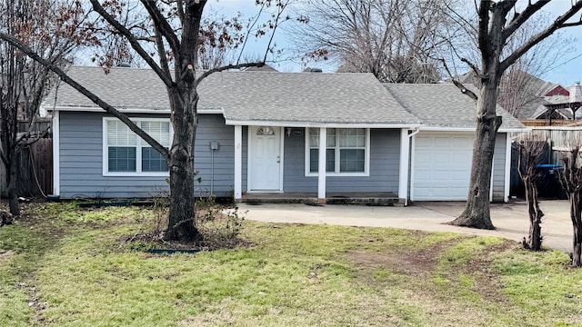 single story home with an attached garage, fence, concrete driveway, roof with shingles, and a front yard