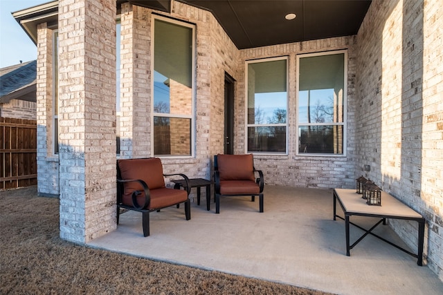 view of patio featuring fence