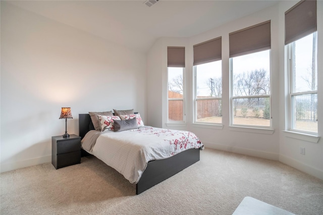 carpeted bedroom featuring baseboards