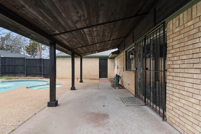 view of patio with a fenced in pool and fence private yard