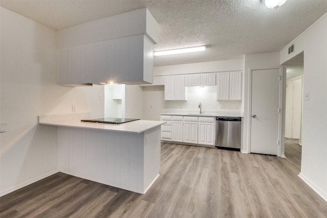 kitchen with visible vents, dishwasher, light countertops, black cooktop, and a sink