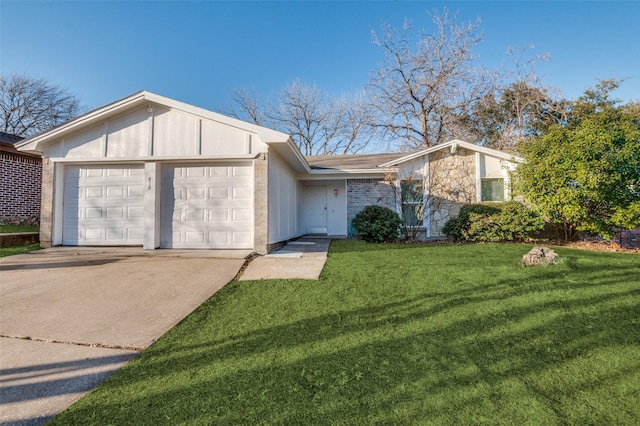 view of front of house with a garage, driveway, stone siding, a front lawn, and brick siding