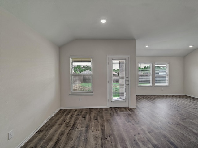 interior space with recessed lighting, dark wood-style flooring, vaulted ceiling, and baseboards