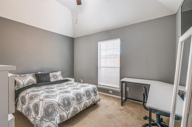 carpeted bedroom featuring lofted ceiling, a ceiling fan, and baseboards