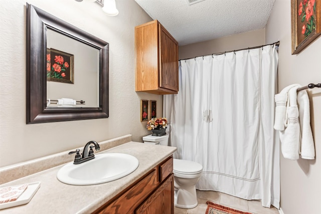 full bath featuring a textured ceiling, curtained shower, toilet, vanity, and tile patterned floors