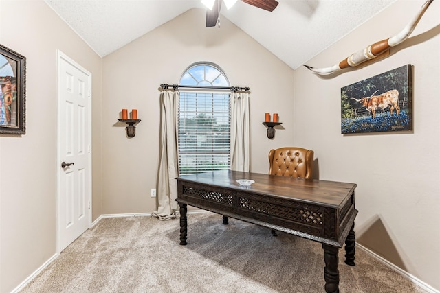 carpeted home office with vaulted ceiling, baseboards, and ceiling fan