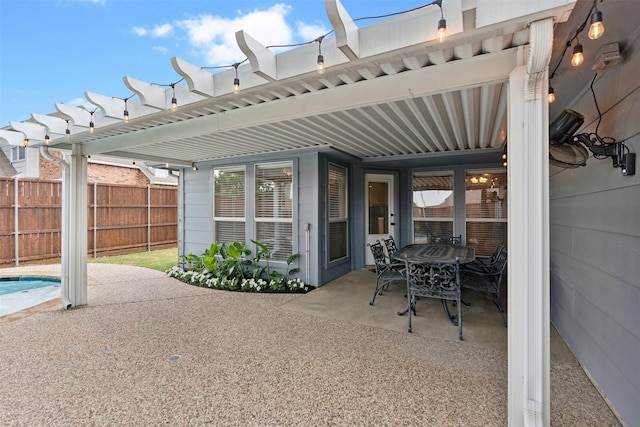 view of patio featuring a fenced in pool, fence, a pergola, and outdoor dining space