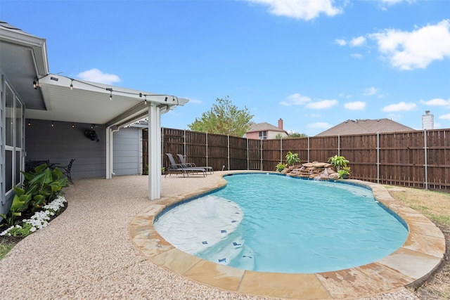 view of swimming pool featuring a fenced in pool, a patio area, and a fenced backyard