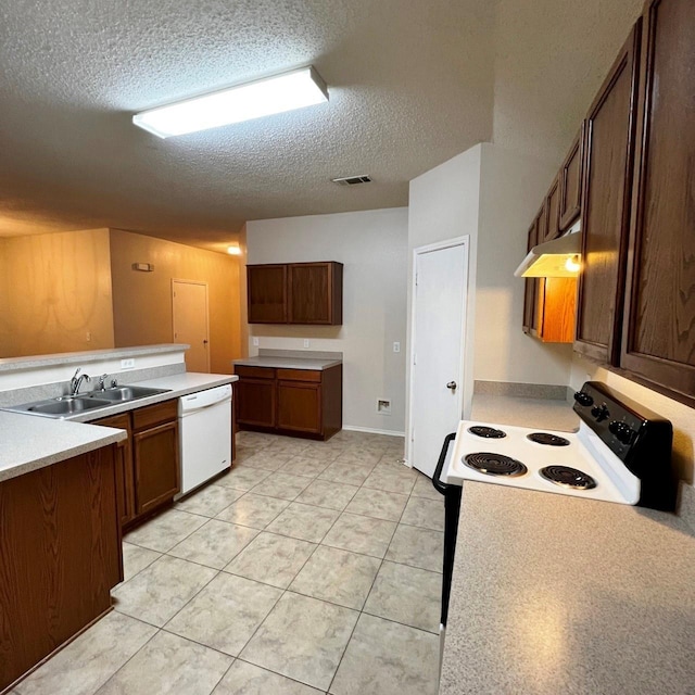 kitchen featuring visible vents, a sink, a textured ceiling, dishwasher, and under cabinet range hood