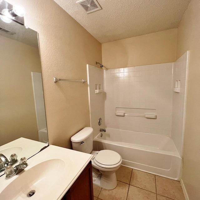 bathroom featuring visible vents, a textured ceiling, and tile patterned floors