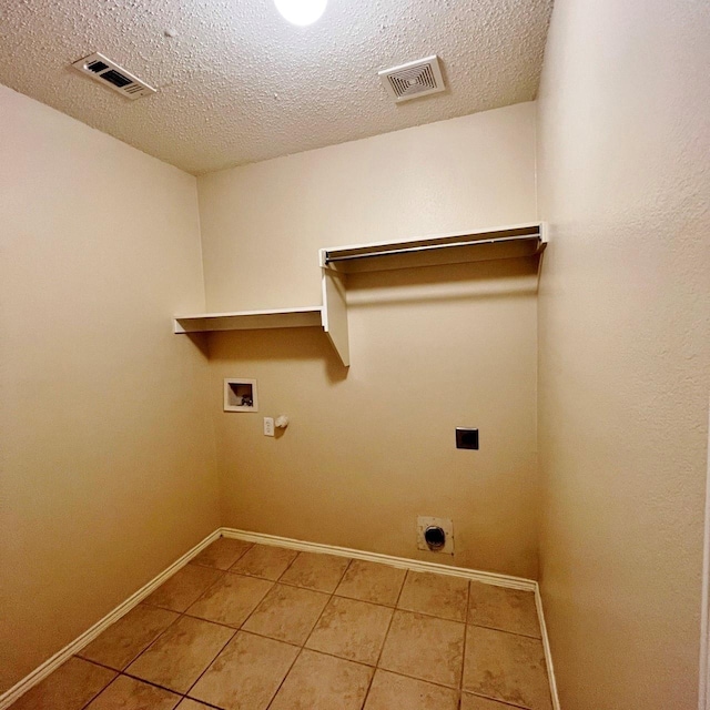 clothes washing area featuring washer hookup, laundry area, visible vents, and electric dryer hookup