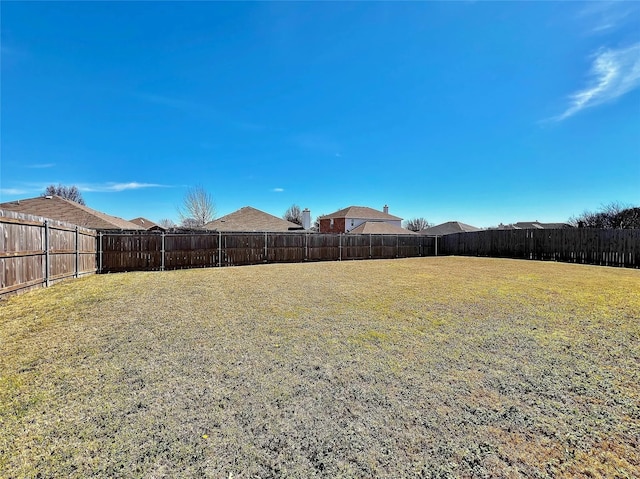 view of yard with a fenced backyard