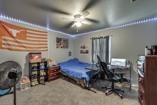 bedroom featuring a textured ceiling, ceiling fan, and carpet flooring