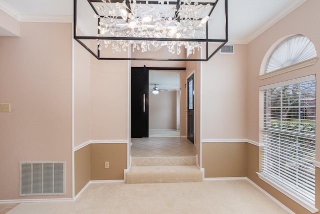 hallway featuring carpet floors, visible vents, and crown molding