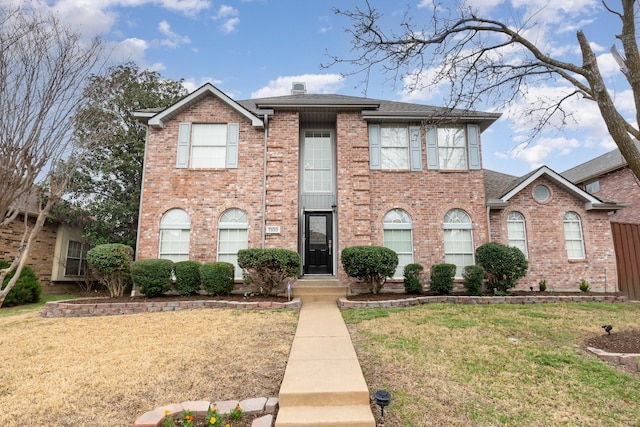 7100 Amethyst Ln, Plano, TX 75025 - view of front of house featuring a front lawn, brick siding, and a shingled roof