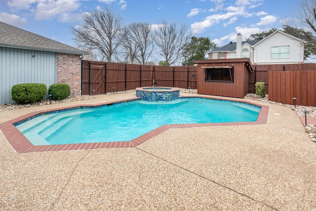 7100 Amethyst Ln, Plano, TX 75025 - view of pool with a fenced backyard, a patio, a pool with connected hot tub, and an outdoor structure