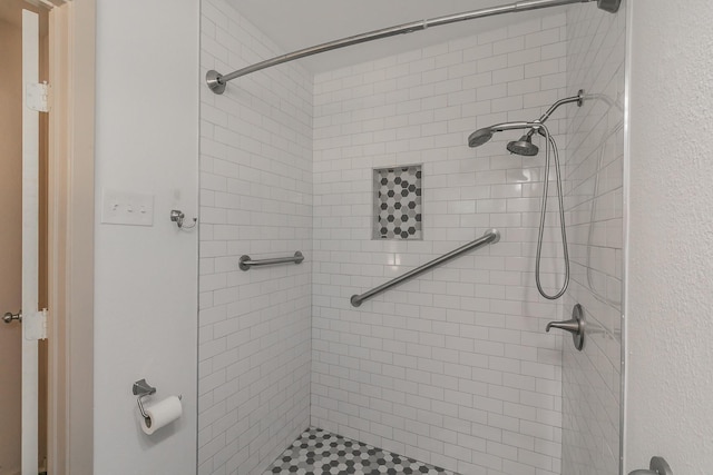 bathroom with a stall shower