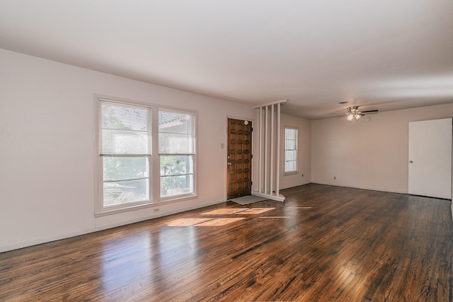 unfurnished living room with wood finished floors and a ceiling fan