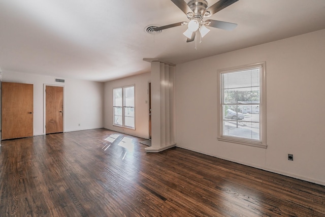 spare room with visible vents, ceiling fan, and wood finished floors