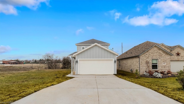 view of side of home featuring a garage, brick siding, a yard, driveway, and board and batten siding