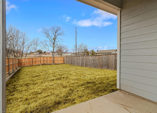 view of yard with a fenced backyard