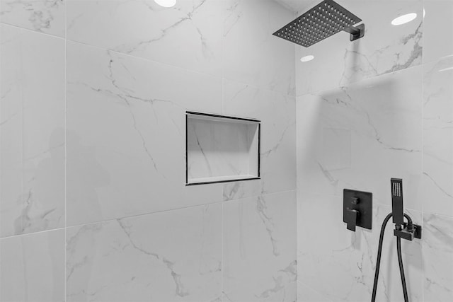 room details with a marble finish shower