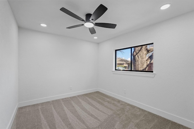 carpeted empty room featuring a ceiling fan, recessed lighting, and baseboards