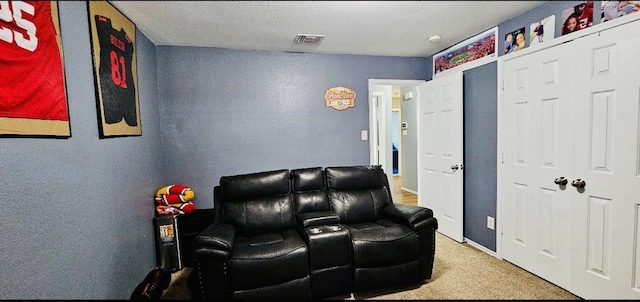 living area with carpet floors and visible vents