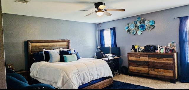 bedroom featuring a ceiling fan and visible vents