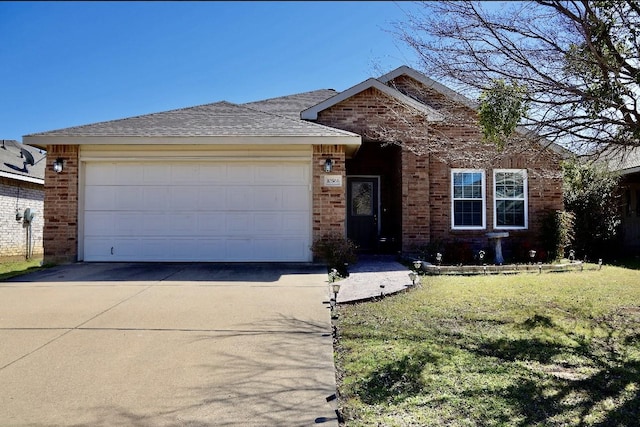 ranch-style house with a garage, driveway, a front yard, and brick siding