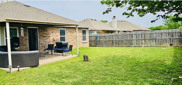 view of yard with a fenced backyard and a patio