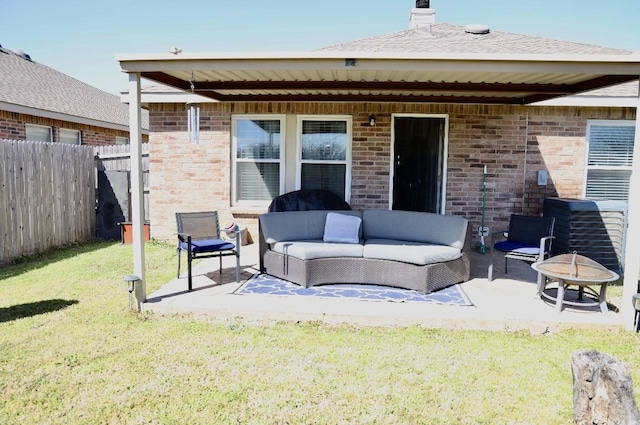 back of house with fence, outdoor lounge area, and brick siding