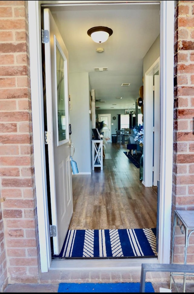 property entrance with visible vents