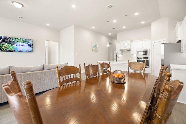 dining area featuring recessed lighting and visible vents