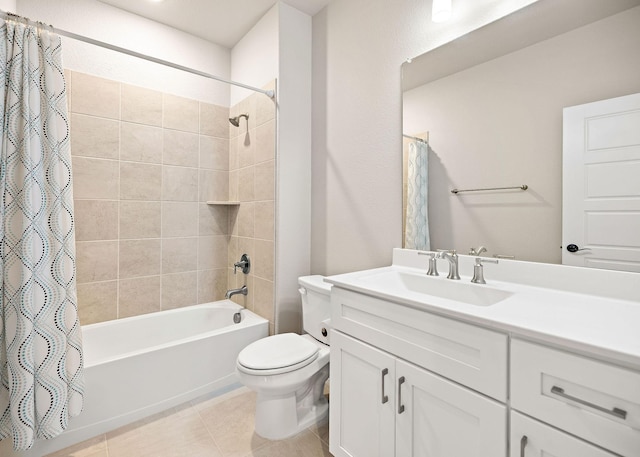 full bath with shower / bath combo, vanity, toilet, and tile patterned floors