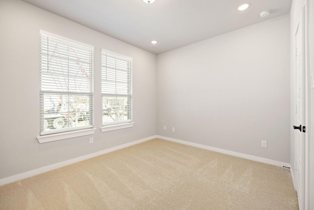 empty room featuring baseboards, carpet flooring, and recessed lighting