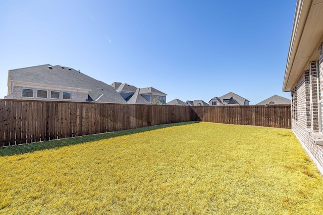 view of yard featuring a fenced backyard