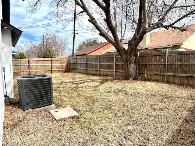 view of yard featuring a fenced backyard and cooling unit