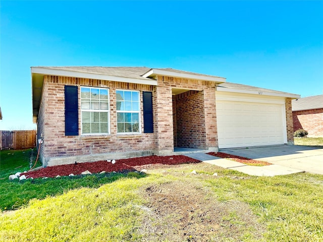 view of front of home with driveway, a garage, fence, and brick siding