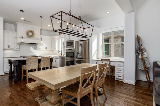 dining space featuring dark wood-style floors, visible vents, and recessed lighting