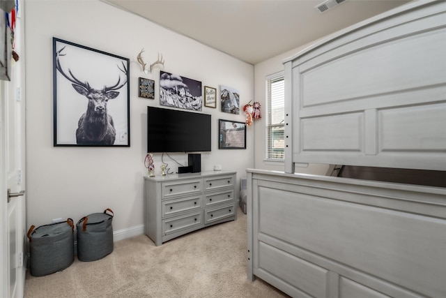 bedroom featuring light carpet, baseboards, and visible vents