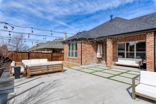 view of patio / terrace with fence and an outdoor hangout area